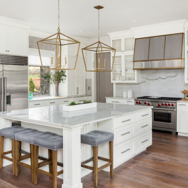 Open concept kitchen with wood flooring and white marble backsplash