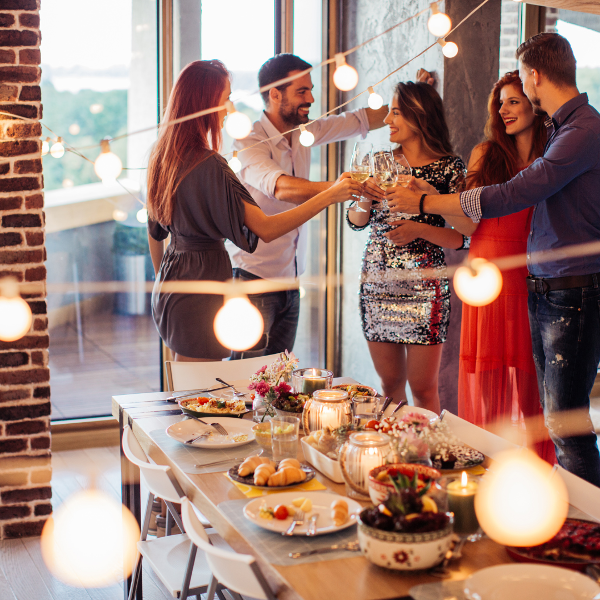 House party in a warmly lit dining area