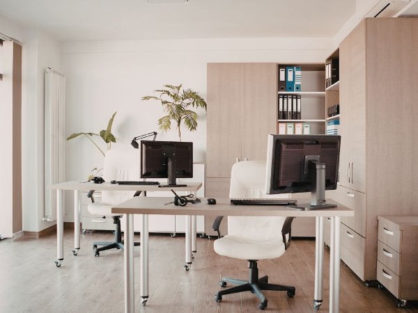 Home office with hardwood flooring